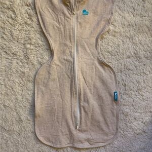 Love to Dream Stretch Cotton Swaddle in Cream with Teal Logo